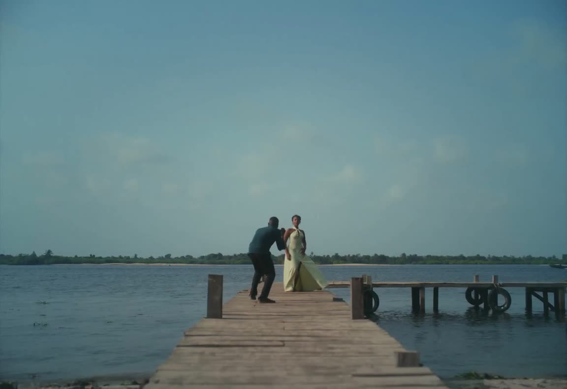 Two performers on a pier in the Raindance reference