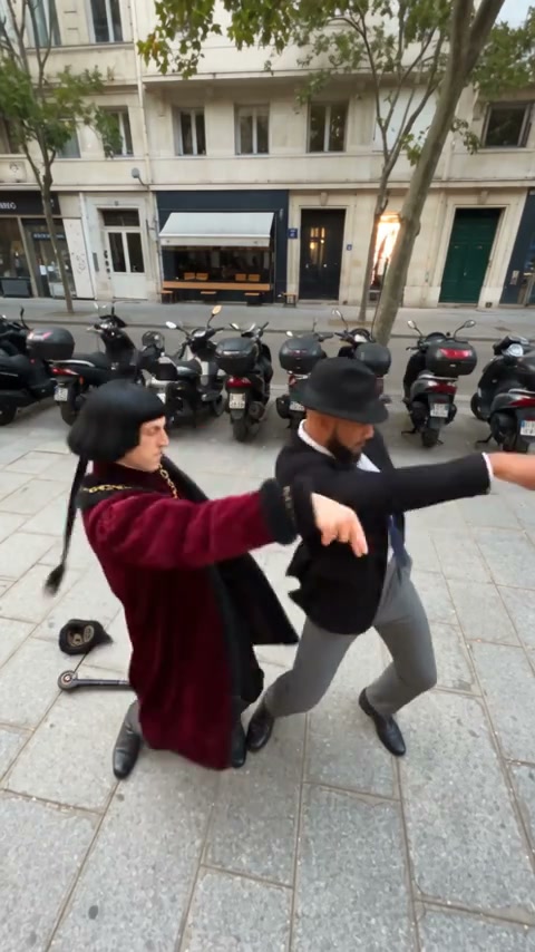 Two human characters trade foreground positions on a street lined with cafés in a Smalltown Boy AI community interpretation.